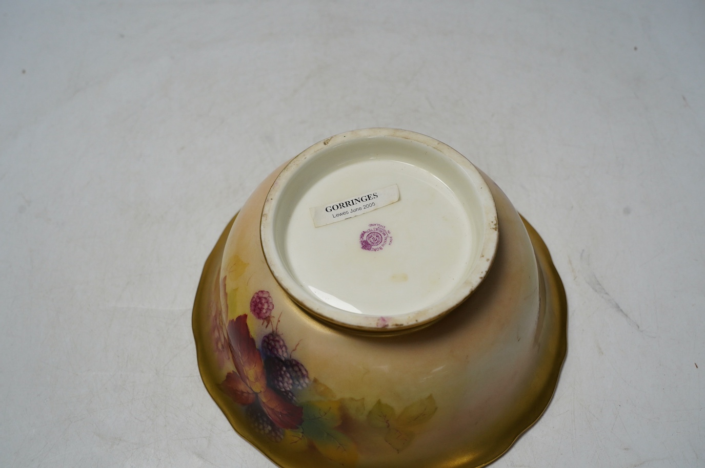 A Worcester bowl hand painted with fruit and leaves by Kitty Blake, 18cm diameter. Condition - good